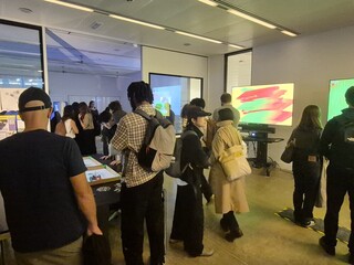 Visitors around the drawing robots at the V&A Digital Design Weekend