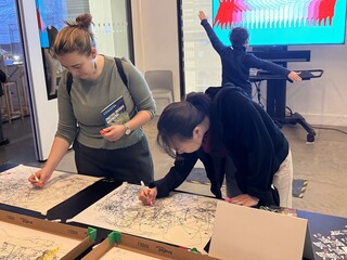 Visitors drawing with the drawing robots at the V&A Digital Design Weekend