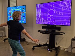 Visitor interacting with a generative screen at the V&A Digital Design Weekend